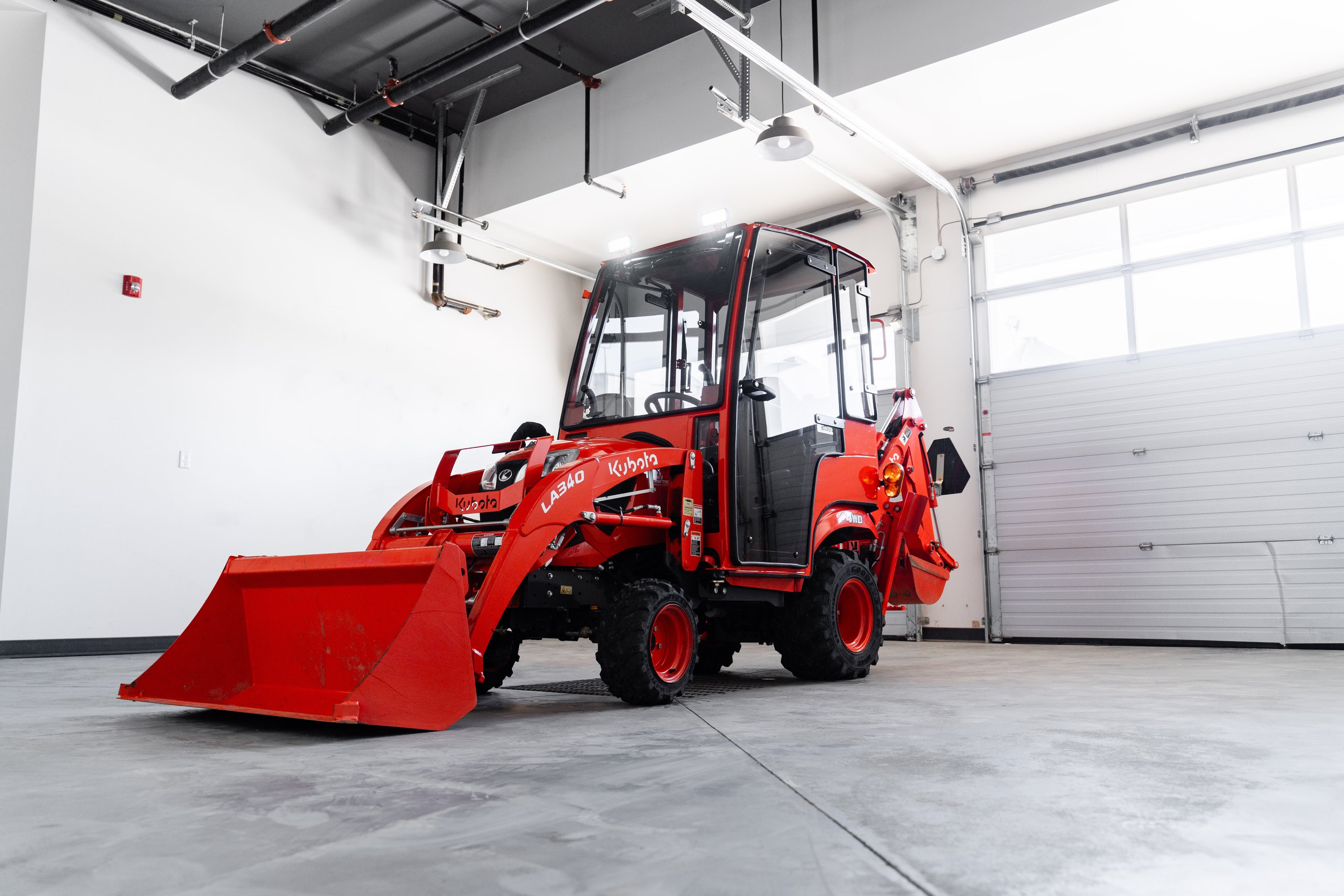 Red construction vehicle in a warehouse setting